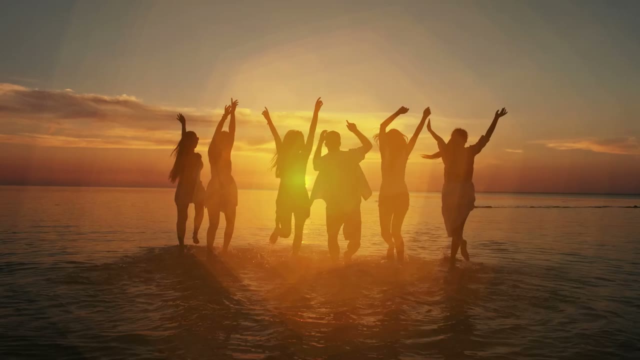 Friends celebrating at sunset